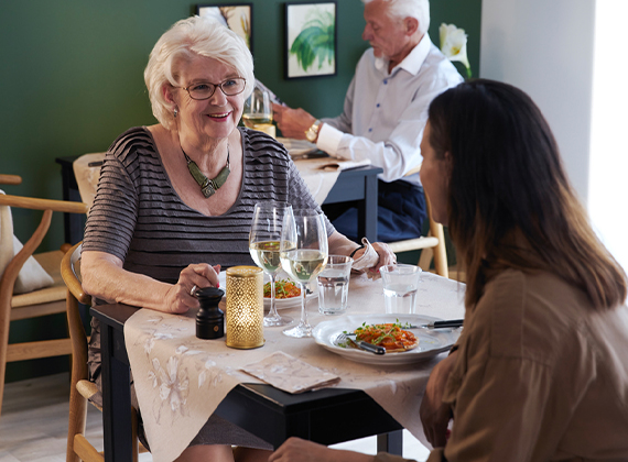 Women dining at lunch in a care home restaurant