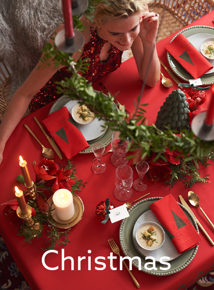 Traditional red Christmas table setting with napkins and table covers