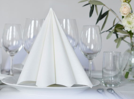 White Dunilin® paper napkin folded on banquet table