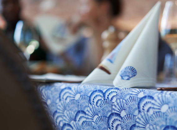 Blue seaside linen feel napkin design with coordinating table runner