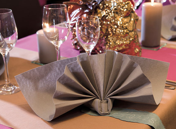 Grey linen feel napkin in formal fold on a banquet table