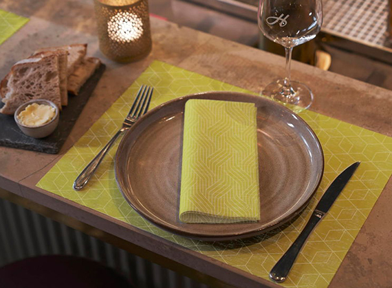 Kiwi geometric design napkin on a matching placemat