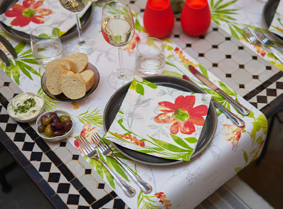 Floral paper napkin on a matching table runner