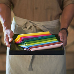 Colourful paper napkins on a tray