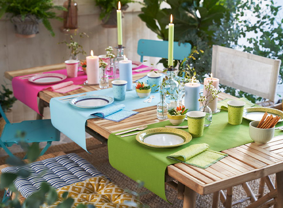 Colourful table runners on a outdoors restaurant table