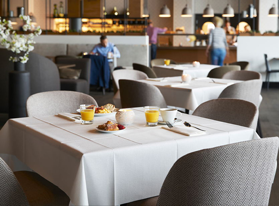 White tablecloths on restaurant tables for breakfast
