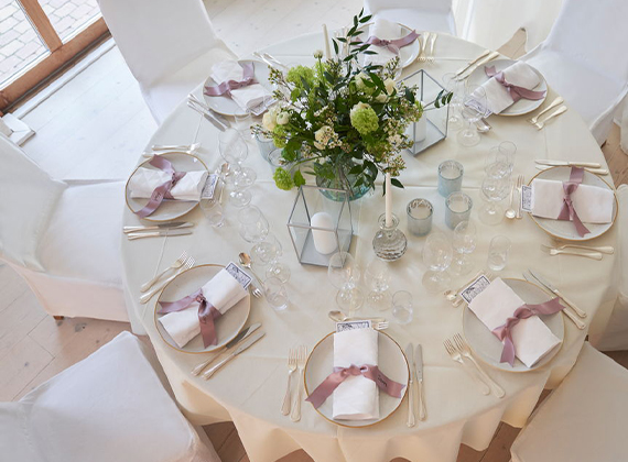 Round cream tablecloth at a hospitality event