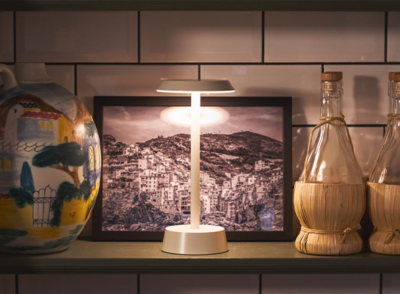 LED Nour table lamp on a shelf